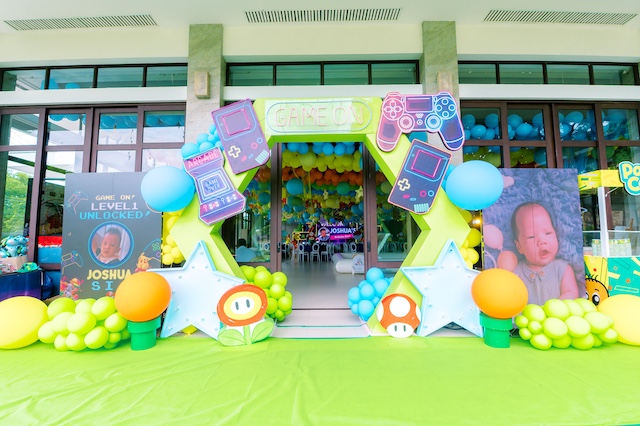 Arcade gaming themed birthday party stage